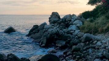 Surfer waves turquoise blue water rocks cliffs boulders Puerto Escondido. video