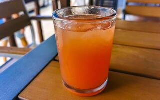 Glass of red watermelon juice in Puerto Escondido Mexico. photo