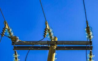 Power pole cable box with blue sky in Mexico. photo