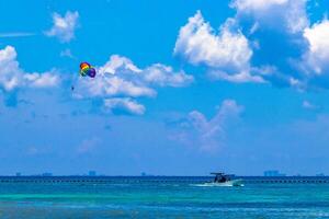 Paragliding with boat in the Caribbean in Mexico. photo