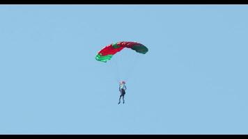 Paraglider Flying Against Clear Blue Sky video