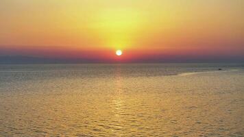 Aerial view of sunset over calm sea video