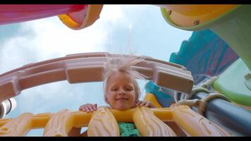 Low angle view of smiling girl at playground video