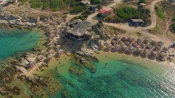 Drone orbiting a rocky island beach video