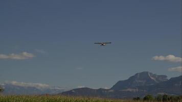 Glider flying against a mountainous backdrop video