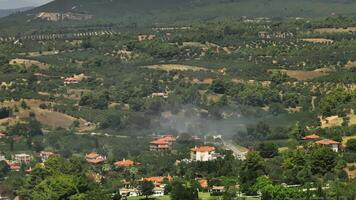 Verdant landscape with smoke signals video