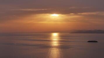 Golden sunrise over calm sea video