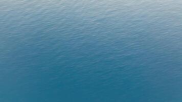 Aerial view of calm ocean surface for vacation setting video