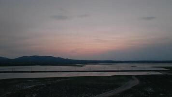 Forward flight over twilight wetlands video