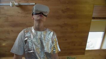 Interactive VR gaming by woman in silver outfit video