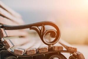 Empty Park wooden bench Closeup view. Wood exterior material. Wo photo