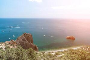 Sea lagoon. Panoramic view on calm azure sea and volcanic rocky photo