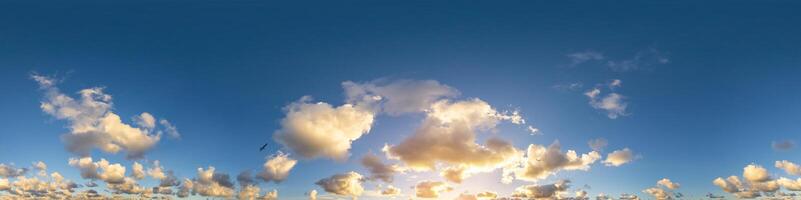 Dark blue sunset sky panorama with Cumulus clouds. Seamless hdr pano in spherical equirectangular format. Complete zenith for 3D visualization, game and sky replacement for aerial drone 360 panoramas. photo