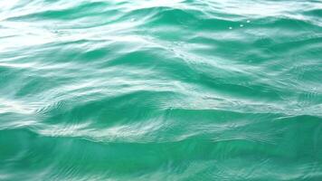 Sea water surface. Camera flies over the calm azure sea. Nobody. Holiday recreation concept. Abstract nautical summer ocean nature. Weather and climate change. Slow motion. Close up video