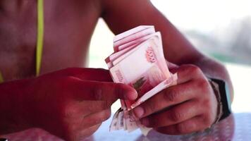 Man hands counting money, close-up. Financial literacy concept, counting paper banknotes, Russian rubles. Unrecognizable person, male hands, outdoor scene video