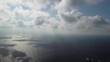 Aerial view. The drone flies over foggy and fluffy clouds. Blue sky sun and sea fog. Abstract aerial nature summer ocean sunset sea and sky background. Vacation, vacation and holiday concept video