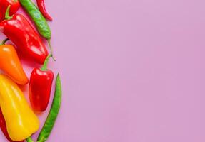 Culinary Concept, Vibrant Assorted Peppers on Pink photo