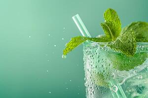 AI generated Close up image of a chilled mint julep glass with condensation droplets, mint sprigs, and a straw, set against a cool, green, gradient background with empty space for text photo