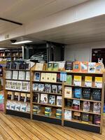 Herceg-Novi, Montenegro - 17 august 2023. Rows of colorful religious literature on shelves in a store photo