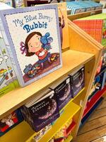 Herceg-Novi, Montenegro - 17 august 2023. Fairy tale books are on the shelves in the store. Caption. My blue bunny Bubbit photo
