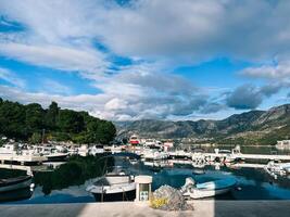 Budva, Montenegro - 25 december 2022. Yachts are moored at the pier with a coastal power bollard photo