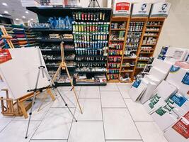 Dubrovnik, Croatia - 25 december 2022. Shelves with stationery, paper, paints, drafting boards in store photo