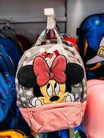 Dubrovnik, Croatia - 25 december 2022. Backpack with a picture of Minnie Mouse hanging in a supermarket photo