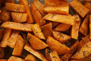 Baked orange sweet potato with spices. Top view photo