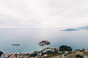 Island of Sveti Stefan in the Bay of Kotor, connected by an isthmus to the mainland. Top view. Montenegro photo