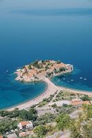 Beach on the isthmus of the island of Sveti Stefan. Montenegro. Top view photo