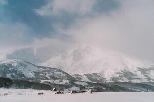 Small village in a snowy mountain valley. Durmitor, Montenegro photo