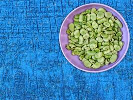 Broad Beans On Wooden Background photo