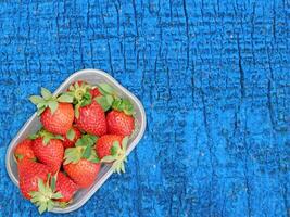 Strawberries On Wooden Background photo