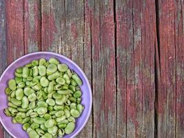 Broad Beans On Wooden Background photo