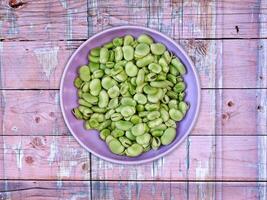 Broad Beans On Wooden Background photo