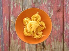 Pasta On Wooden Background photo