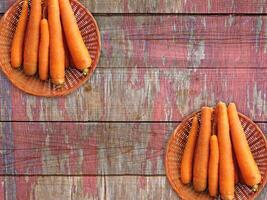 Carrots On The Wooden Background photo