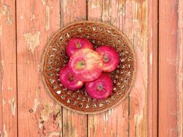 Apples On The Wooden Background photo