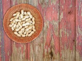 Peanuts On The Wooden Background photo