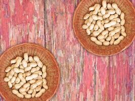 Peanuts On The Wooden Background photo