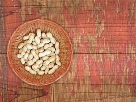 Peanuts On The Wooden Background photo