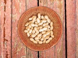 Peanuts On The Wooden Background photo