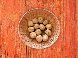 Nuts On The Wooden Background photo