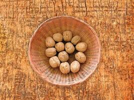 Nuts On The Wooden Background photo