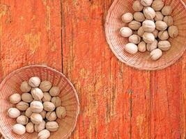 Nuts On The Wooden Background photo