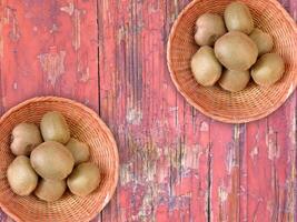 Kiwi On Wooden Background photo