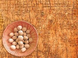 Nuts On The Wooden Background photo