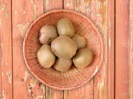 Kiwi On Wooden Background photo