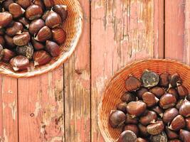 Chestnuts On The Wooden Background photo