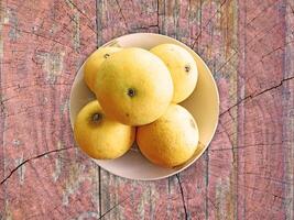 oranges on wooden background photo